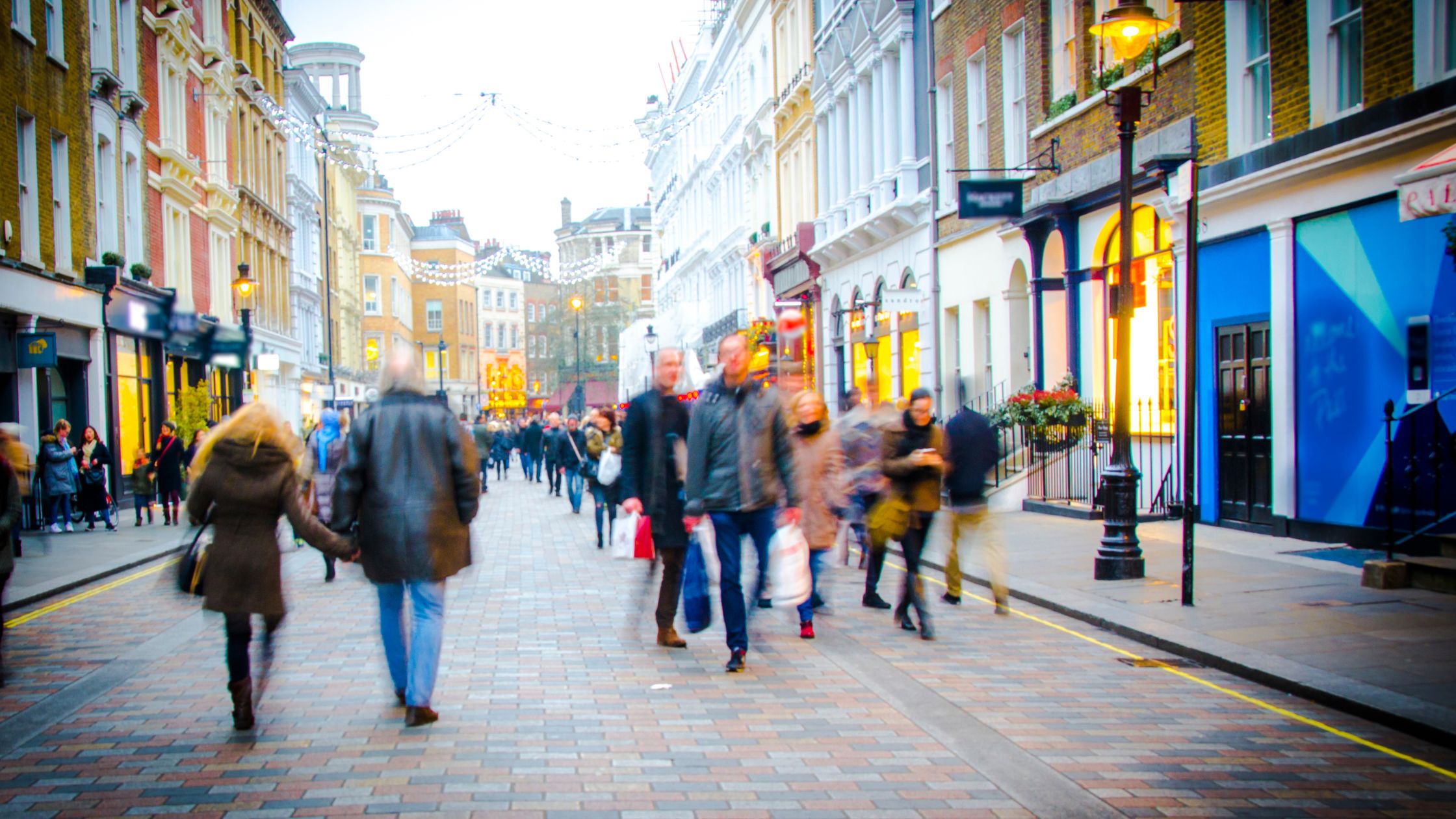 busy high street setting with people and shops